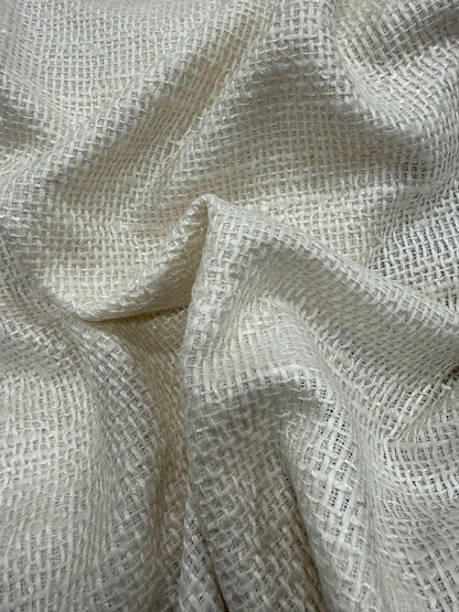 Primer plano de la textura del tweed saco blanco