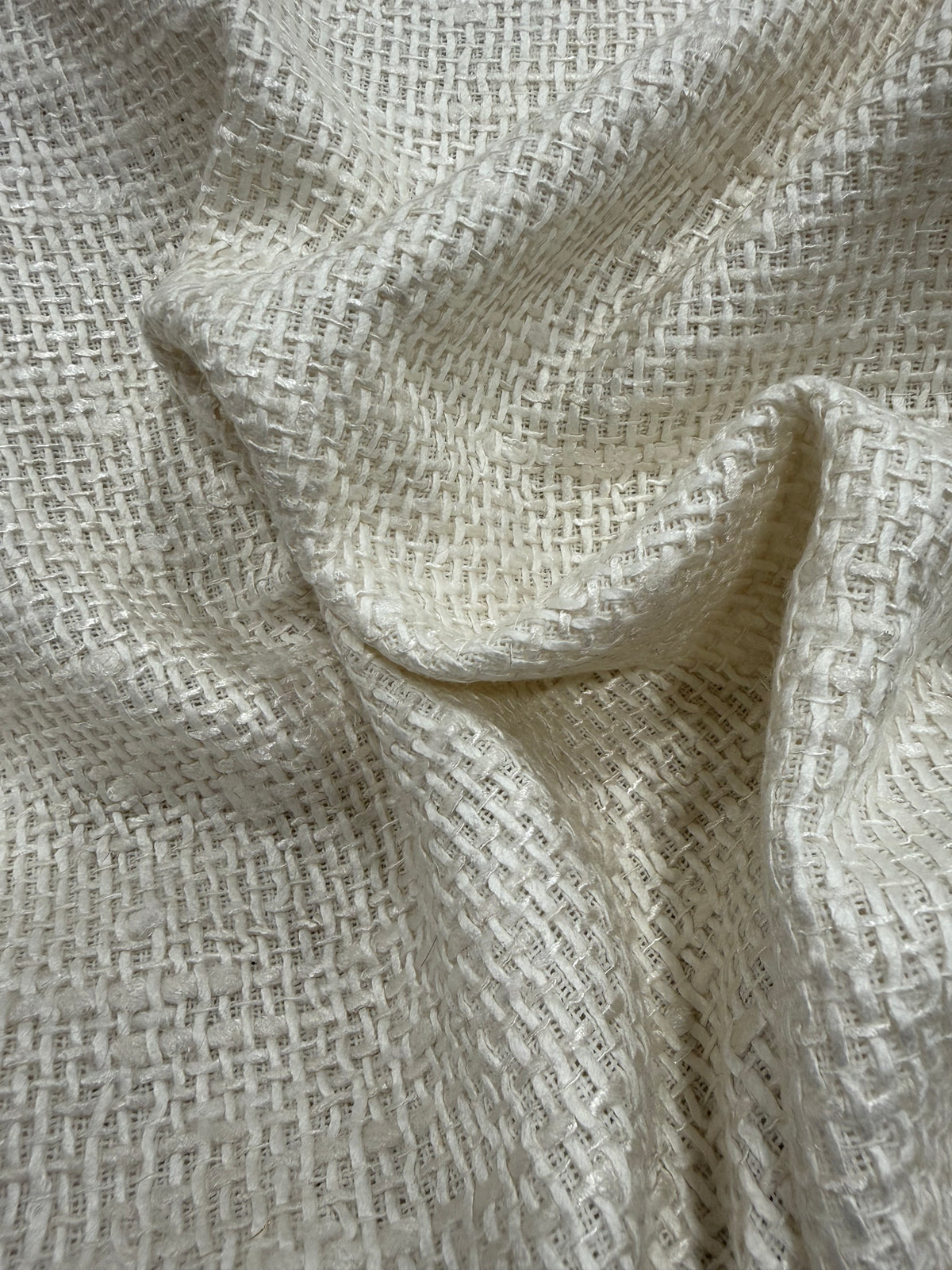 Detalle de la caída del tweed saco blanco