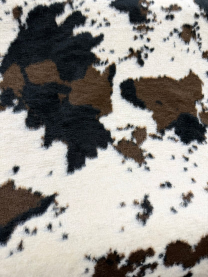 Tela pelito estampado vaca blanco y negro, primer plano de la textura - Arte con Telas