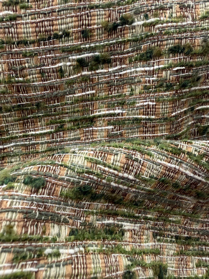 Detalle del efecto jaspeado de la tela verde