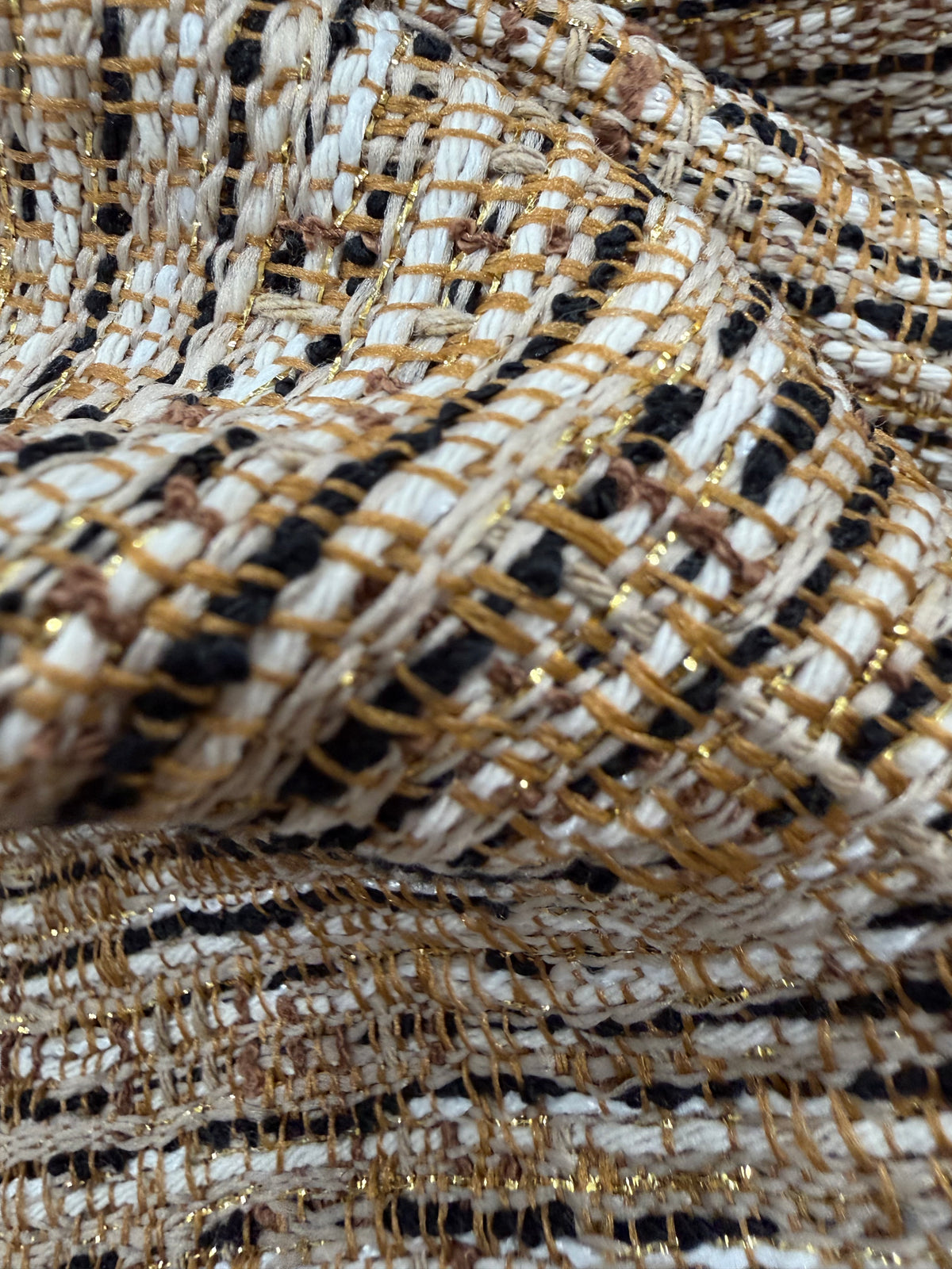 Detalle de la textura del tweed doré