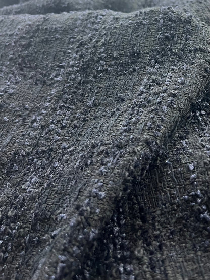Primer plano de los detalles del tweed negro Soberano