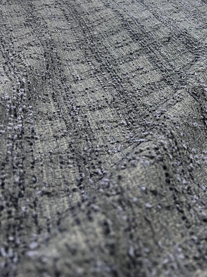 Detalle de la textura del tweed negro Soberano