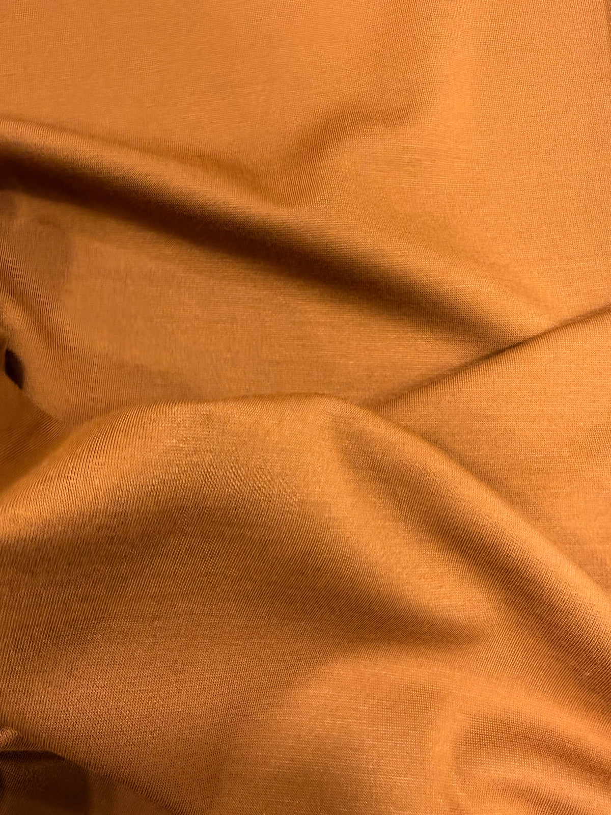 Detalle de la textura del punto naranja quemado - Arte con Telas