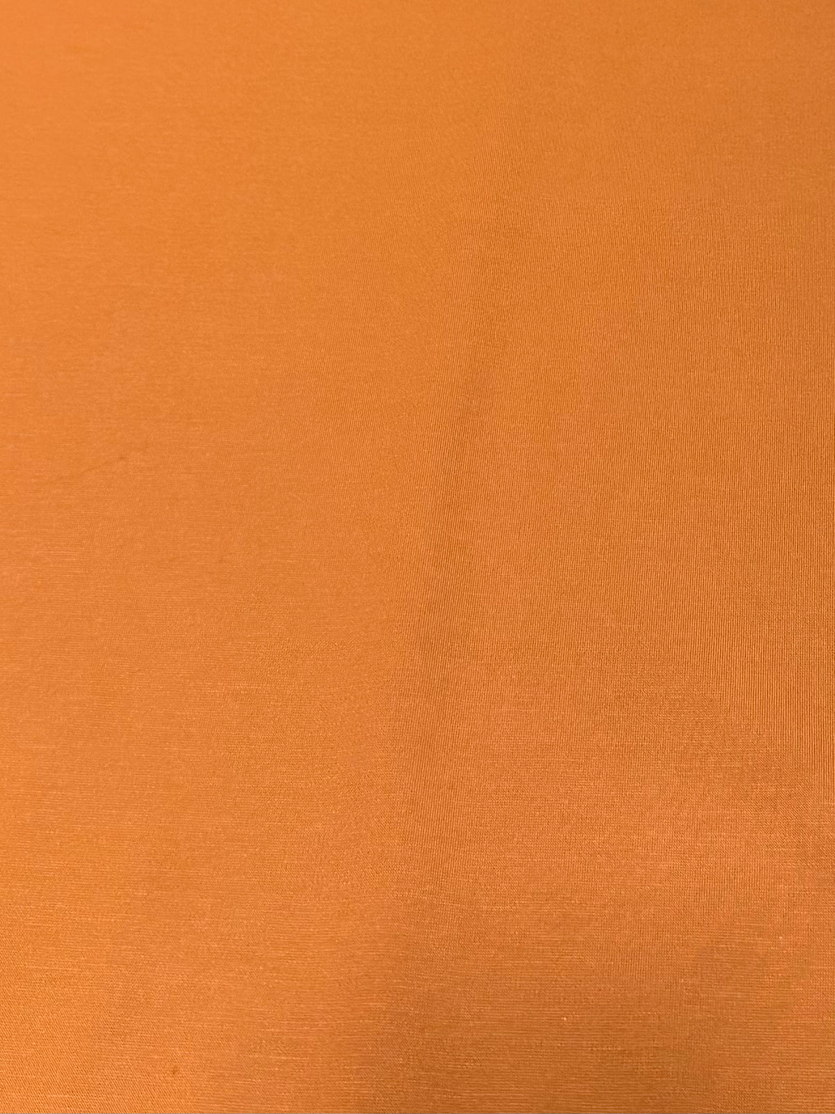 Caída y elasticidad de la tela de punto naranja quemado - Arte con Telas
