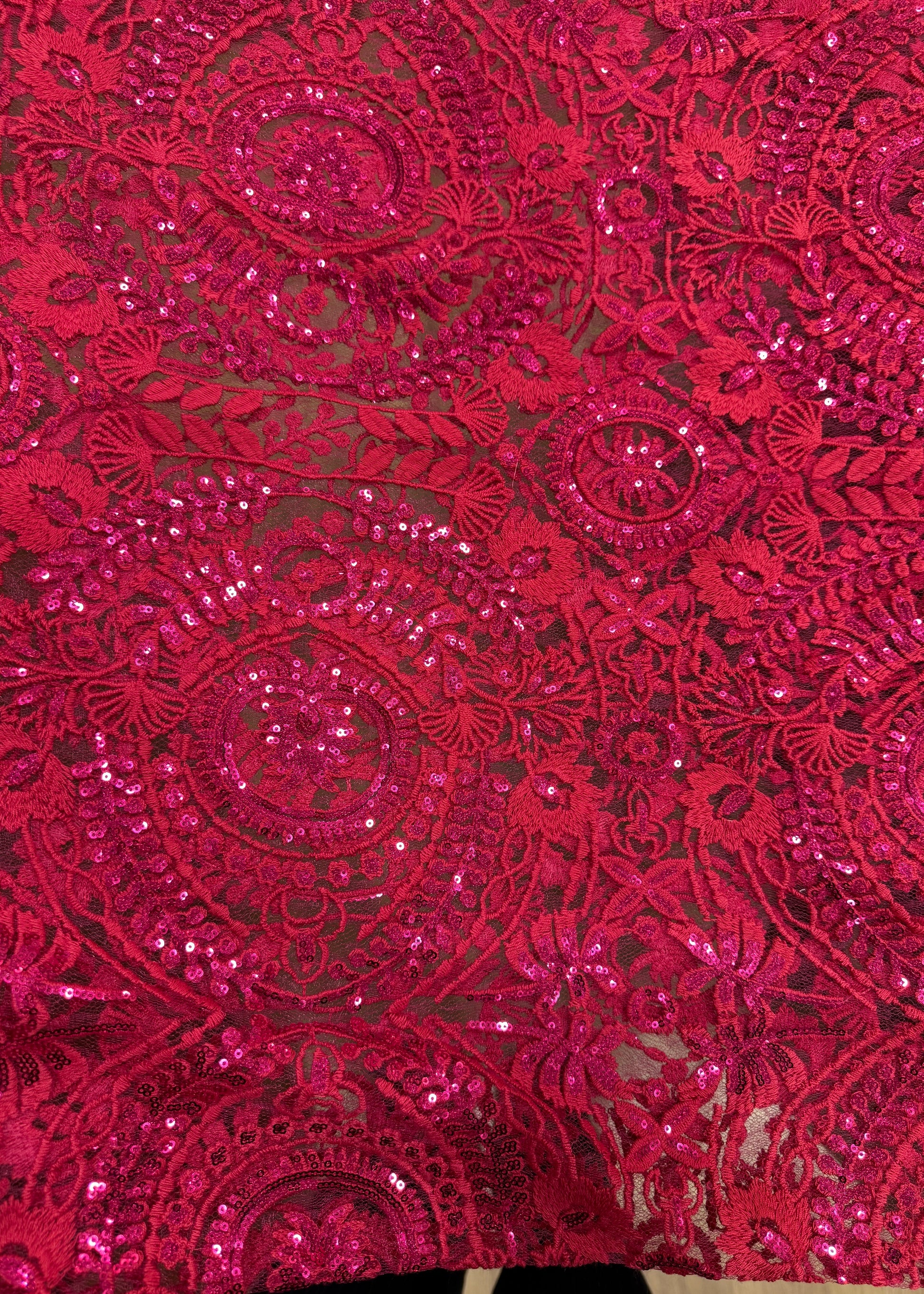 Tul transparente fucsia con bordado denso y brillante